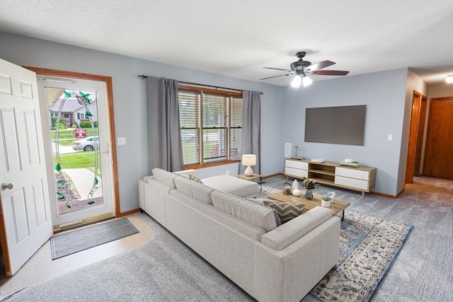 102 Jackson St, Pella, IA 50219 - carpeted living room featuring ceiling fan and baseboards