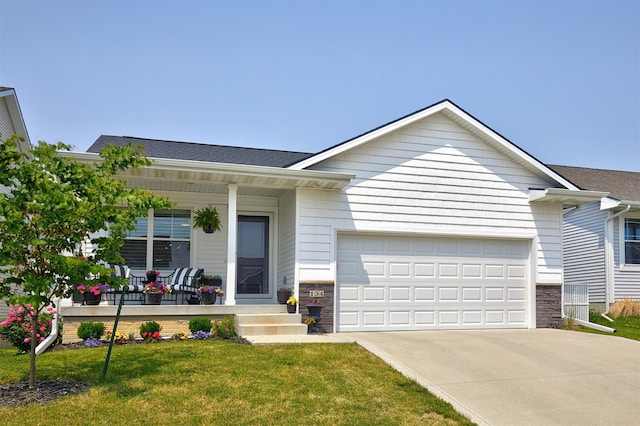 134 Aspen Dr, Norwalk, IA 50211 - ranch-style house with covered porch, driveway, an attached garage, and a front yard