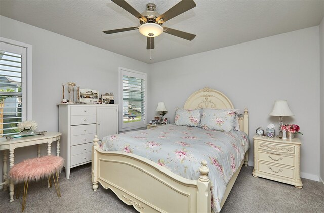 134 Aspen Dr, Norwalk, IA 50211 - carpeted bedroom featuring a ceiling fan