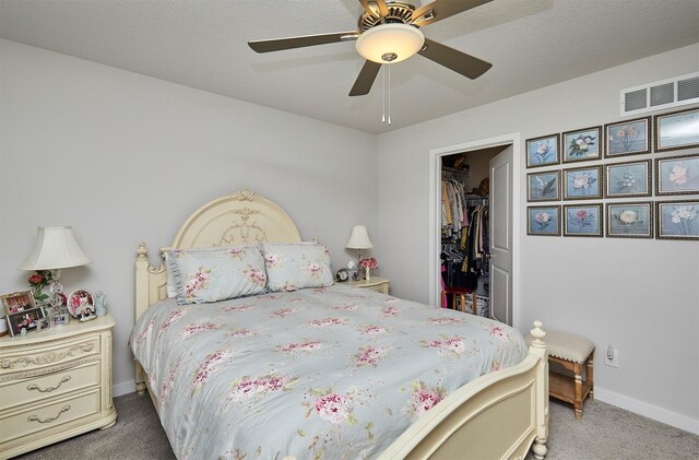 134 Aspen Dr, Norwalk, IA 50211 - bedroom featuring carpet, a closet, baseboards, a spacious closet, and ceiling fan