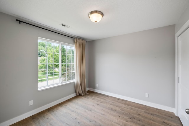 3605 Village Run Dr, Des Moines, IA 50317 - unfurnished room featuring wood finished floors and baseboards