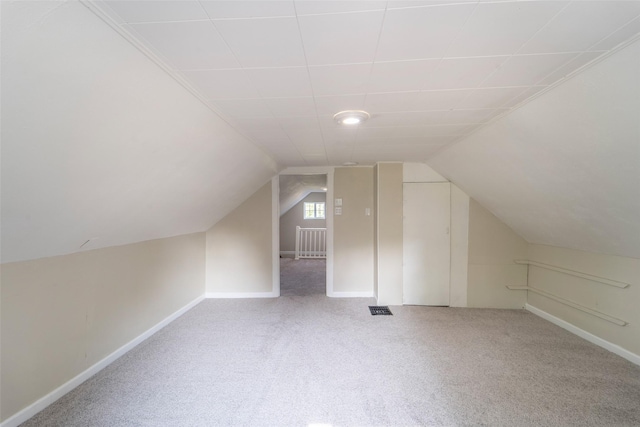 2336 E 13th St, Des Moines, IA 50316 - bonus room with carpet floors, lofted ceiling, and baseboards