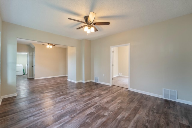 2336 E 13th St, Des Moines, IA 50316 - unfurnished room featuring a ceiling fan, washer / dryer, dark wood-style floors, and baseboards