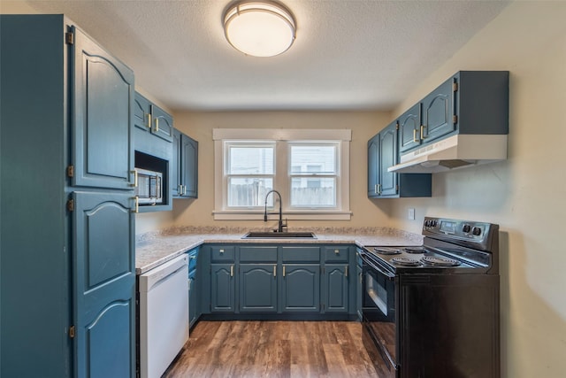 2336 E 13th St, Des Moines, IA 50316 - kitchen featuring electric range, dishwasher, a sink, under cabinet range hood, and dark wood finished floors