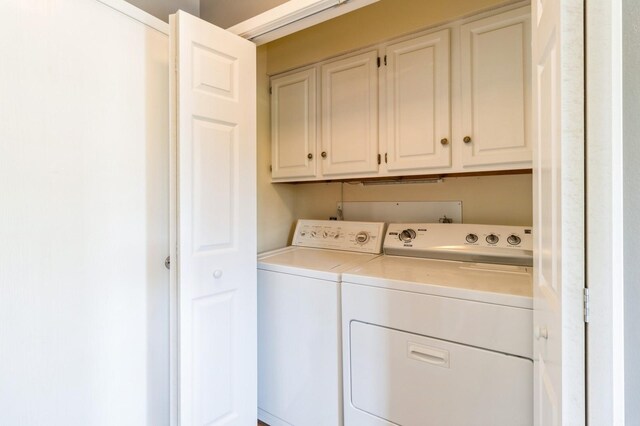 2405 81st Cir, Urbandale, IA 50322 - washroom featuring independent washer and dryer and cabinet space