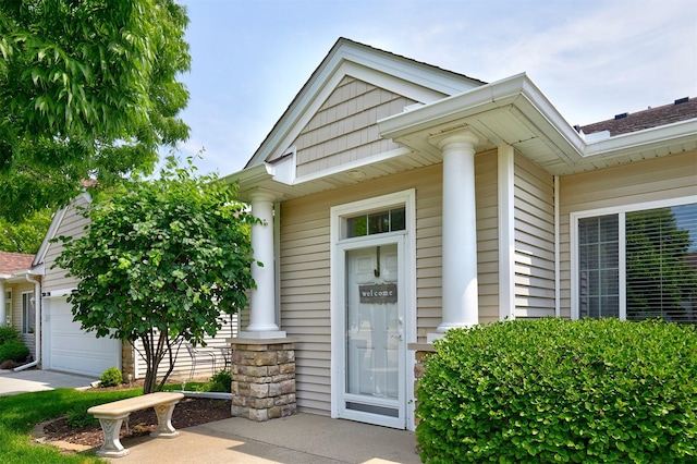 280 S 79th St Unit 1302, West Des Moines, IA 50266 - view of exterior entry with a garage