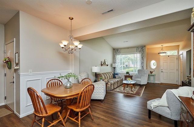 280 S 79th St Unit 1302, West Des Moines, IA 50266 - dining room with a chandelier, wood finished floors, and wainscoting