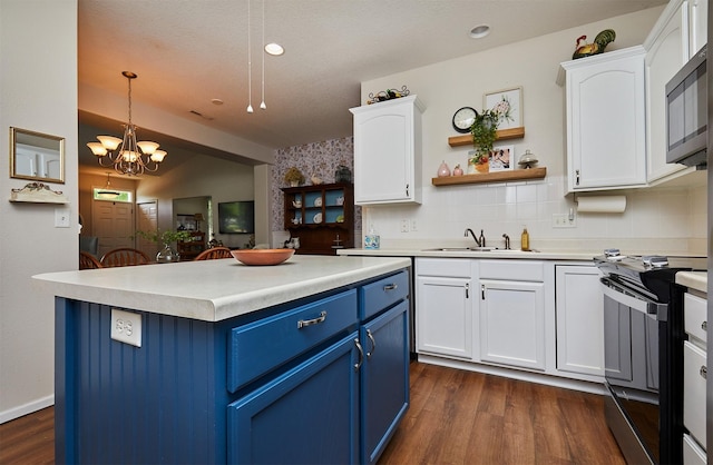 280 S 79th St Unit 1302, West Des Moines, IA 50266 - kitchen featuring blue cabinets, range, a sink, white cabinetry, and recessed lighting