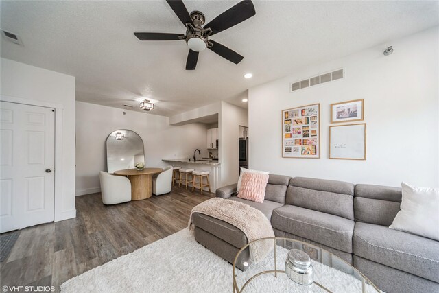 8601 Westown Pkwy Unit 21207, West Des Moines, IA 50266 - living room with ceiling fan, dark wood-style floors, recessed lighting, and baseboards