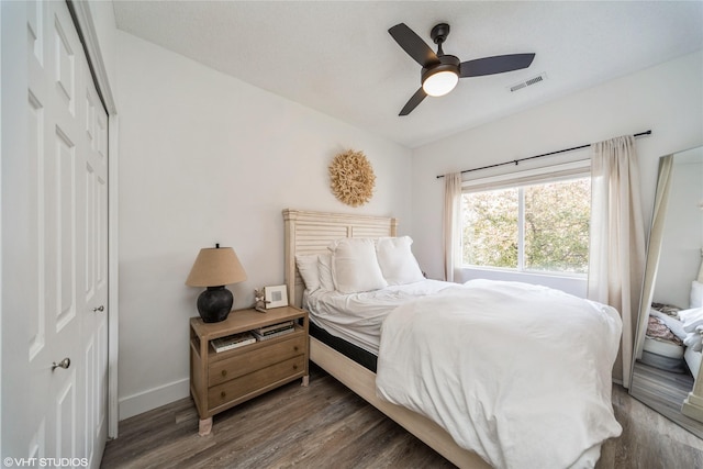 8601 Westown Pkwy Unit 21207, West Des Moines, IA 50266 - bedroom featuring a closet, wood finished floors, baseboards, and a ceiling fan