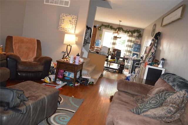 104 Walnut Dr NW, Bondurant, IA 50035 - living area with wood-type flooring