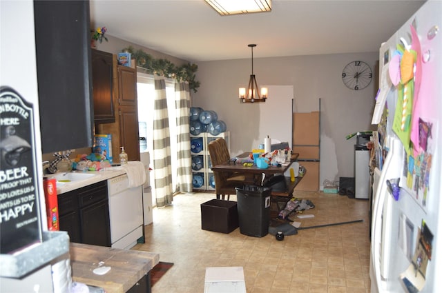 104 Walnut Dr NW, Bondurant, IA 50035 - kitchen featuring a chandelier, light countertops, dishwasher, and hanging light fixtures