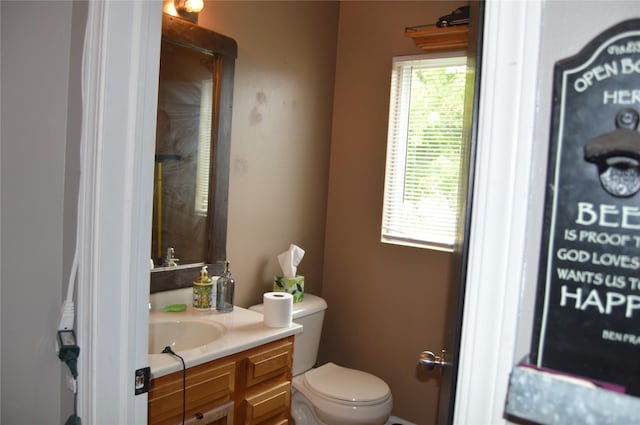 104 Walnut Dr NW, Bondurant, IA 50035 - bathroom featuring healthy amount of natural light, vanity, toilet, and a shower