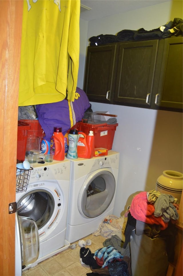 104 Walnut Dr NW, Bondurant, IA 50035 - laundry room featuring washing machine and dryer, cabinet space, and tile patterned floors
