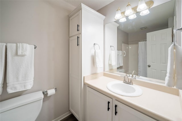 1117 S 52nd St Unit 1707, West Des Moines, IA 50265 - bathroom featuring toilet, vanity, and a shower with shower curtain