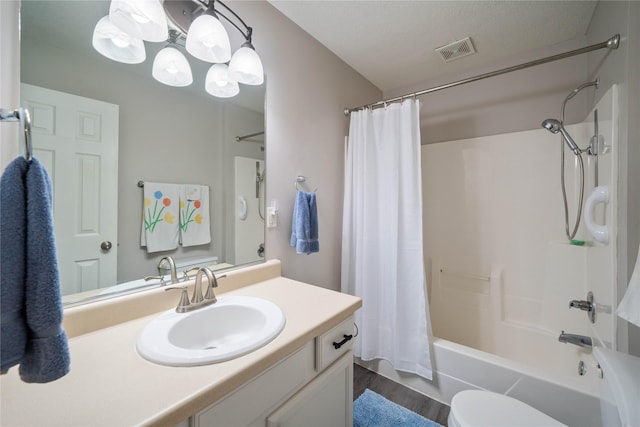 1117 S 52nd St Unit 1707, West Des Moines, IA 50265 - full bath featuring vanity, shower / tub combo with curtain, toilet, and wood finished floors
