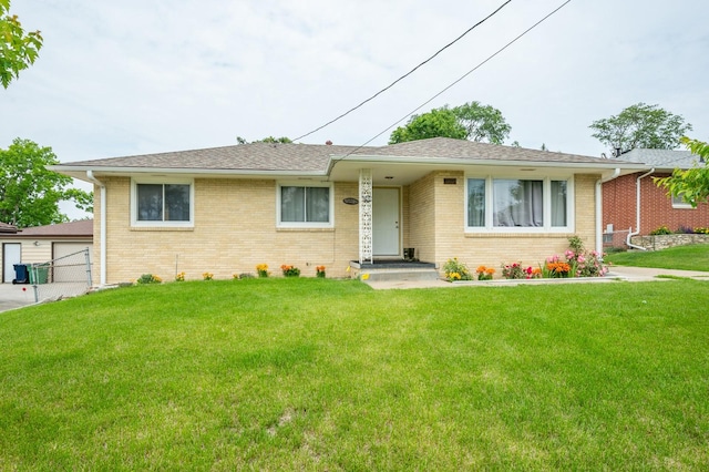 7409 Palm Dr, Urbandale, IA 50322 - view of front of property with brick siding and roof with shingles