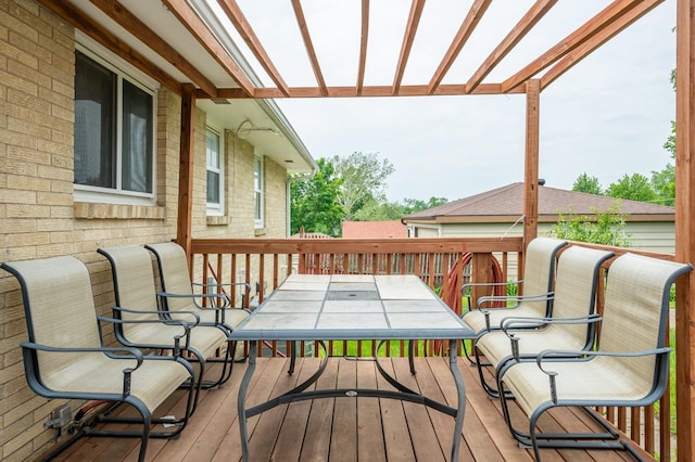 7409 Palm Dr, Urbandale, IA 50322 - deck featuring outdoor dining area