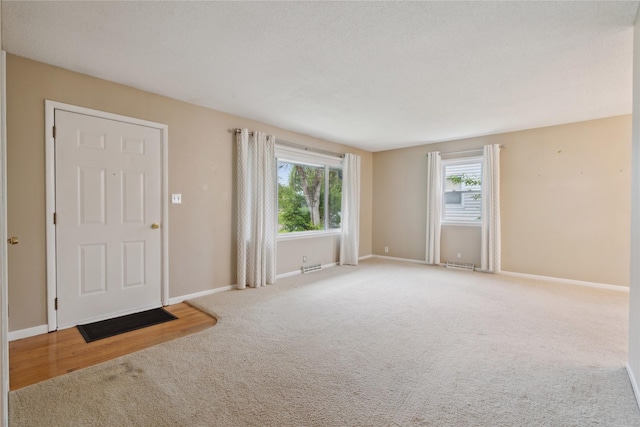 2901 E 40th Ct, Des Moines, IA 50317 - carpeted entrance foyer with healthy amount of natural light and baseboards