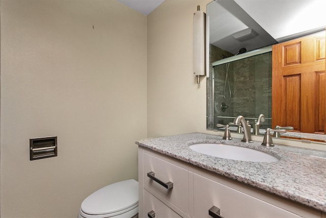 3510 Wolcott Ave, Des Moines, IA 50321 - bathroom featuring vanity, a stall shower, and toilet