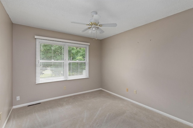 3510 Wolcott Ave, Des Moines, IA 50321 - empty room with carpet flooring, baseboards, and a textured ceiling