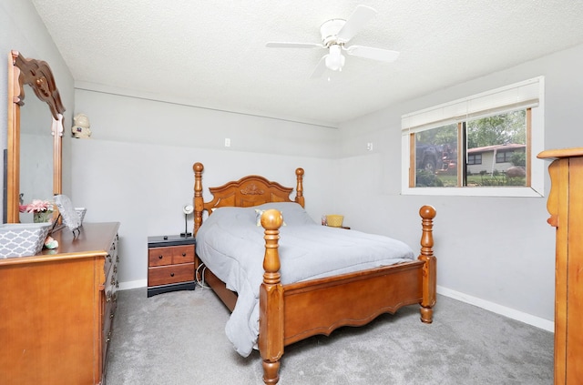 3811 SW 3rd St, Des Moines, IA 50315 - carpeted bedroom with baseboards, a ceiling fan, and a textured ceiling