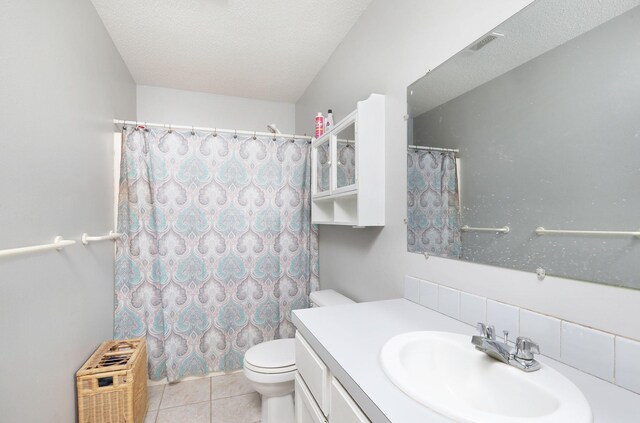 3811 SW 3rd St, Des Moines, IA 50315 - full bath with vanity, toilet, tile patterned flooring, a textured ceiling, and a shower with curtain