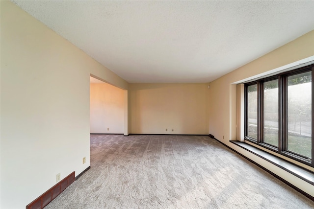 1495 Rio Valley Dr, Clive, IA 50325 - carpeted empty room with a baseboard radiator and baseboards