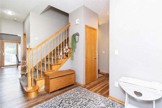 7129 Ridgedale Ct, Johnston, IA 50131 - stairway featuring wood finished floors and baseboards