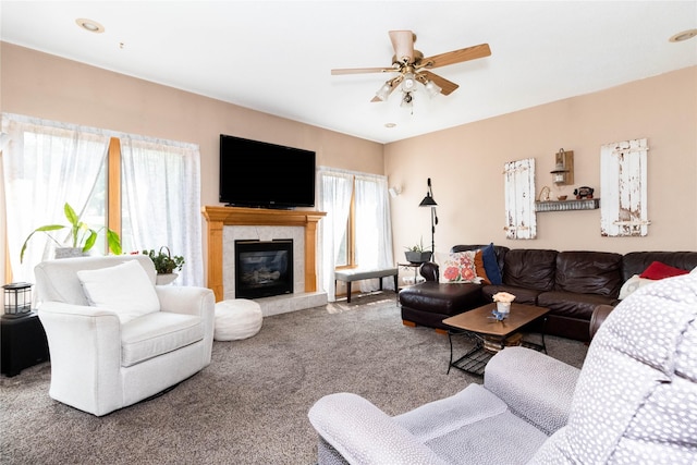 7129 Ridgedale Ct, Johnston, IA 50131 - living area with carpet, a fireplace, and a ceiling fan
