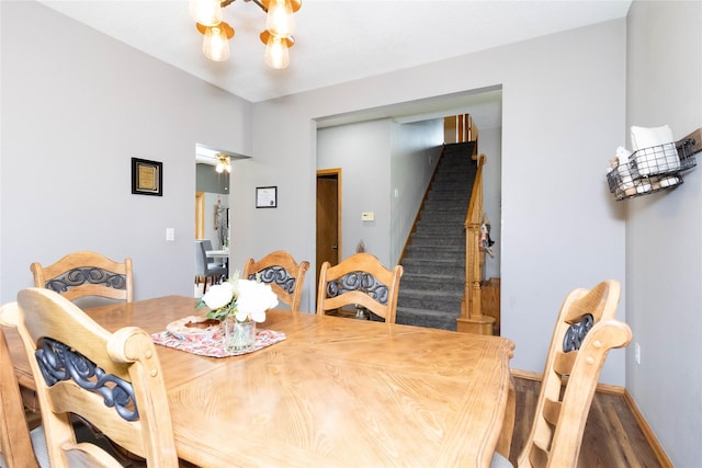 7129 Ridgedale Ct, Johnston, IA 50131 - dining room featuring stairway, wood finished floors, and a chandelier