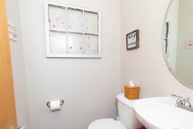 7129 Ridgedale Ct, Johnston, IA 50131 - bathroom featuring toilet and a sink