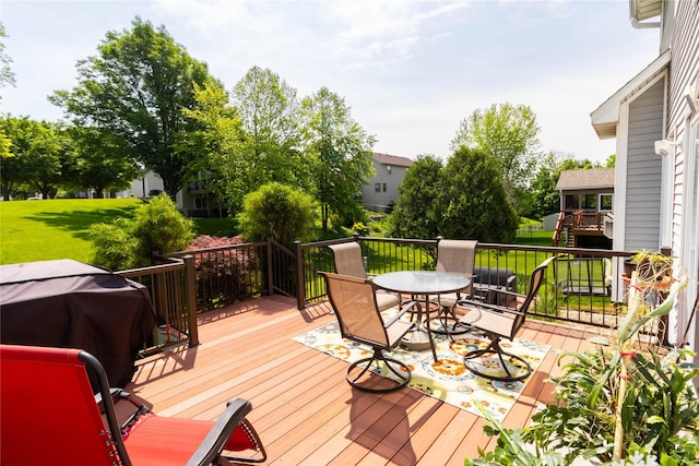 7129 Ridgedale Ct, Johnston, IA 50131 - wooden deck with outdoor dining area and grilling area