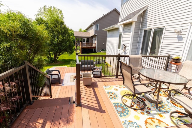 7129 Ridgedale Ct, Johnston, IA 50131 - wooden terrace featuring outdoor dining space
