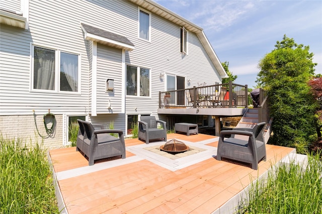 7129 Ridgedale Ct, Johnston, IA 50131 - wooden deck with an outdoor living space with a fire pit