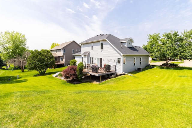 7129 Ridgedale Ct, Johnston, IA 50131 - rear view of house with a wooden deck and a lawn