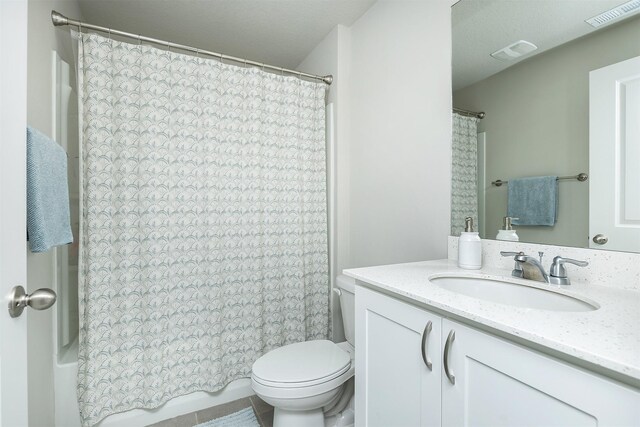 6828 NW 106th St, Johnston, IA 50131 - bathroom with vanity, toilet, shower / bath combination with curtain, and tile patterned flooring