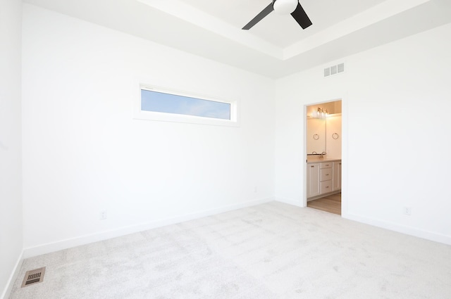 2412 NE 6th St, Grimes, IA 50111 - unfurnished room featuring light carpet, a ceiling fan, and baseboards