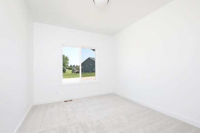 2412 NE 6th St, Grimes, IA 50111 - unfurnished room featuring carpet and baseboards