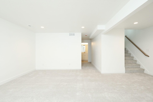 2412 NE 6th St, Grimes, IA 50111 - unfurnished room with light carpet, stairway, recessed lighting, and baseboards