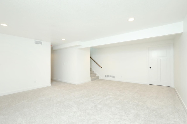 2412 NE 6th St, Grimes, IA 50111 - finished below grade area with recessed lighting, stairway, carpet, and baseboards