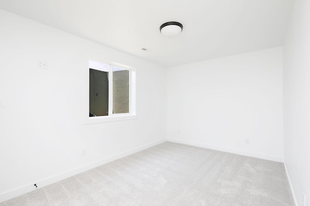 2412 NE 6th St, Grimes, IA 50111 - carpeted empty room with baseboards