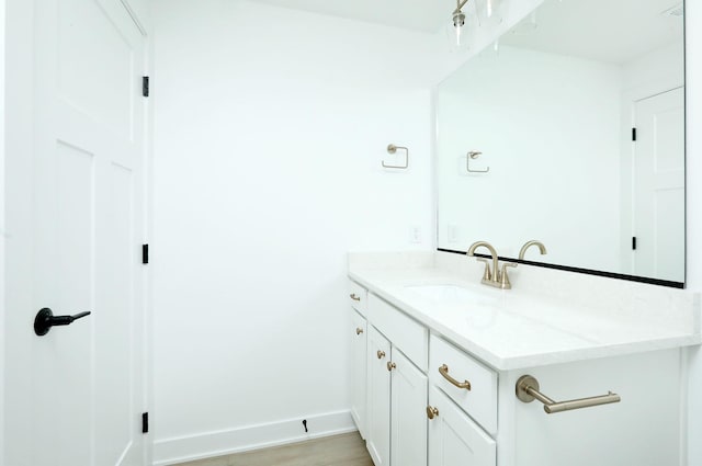 2412 NE 6th St, Grimes, IA 50111 - bathroom with vanity and baseboards