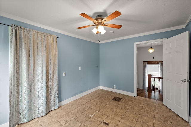 428 Crawford St, Boone, IA 50036 - empty room featuring ceiling fan, baseboards, and tile patterned floors