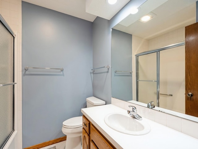 10823 Elmcrest Dr, Clive, IA 50325 - full bath with toilet, vanity, and baseboards