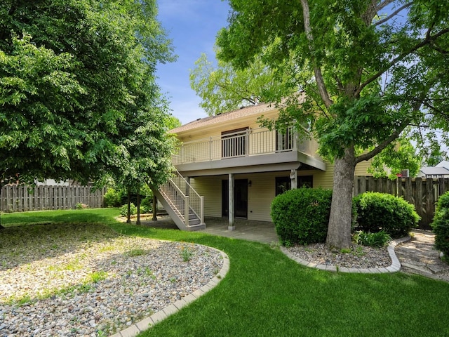 10823 Elmcrest Dr, Clive, IA 50325 - rear view of house featuring stairway, a patio, and a deck