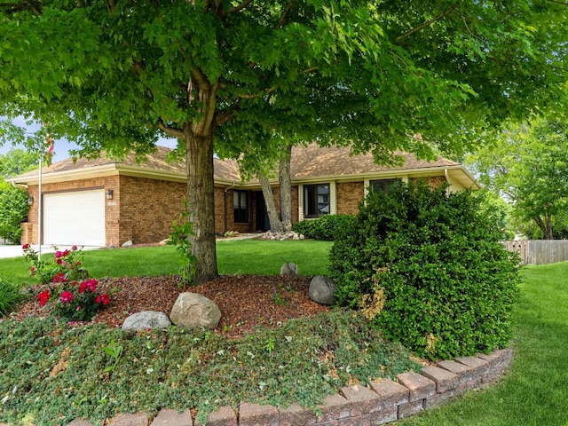 10823 Elmcrest Dr, Clive, IA 50325 - view of front of home with a garage and brick siding