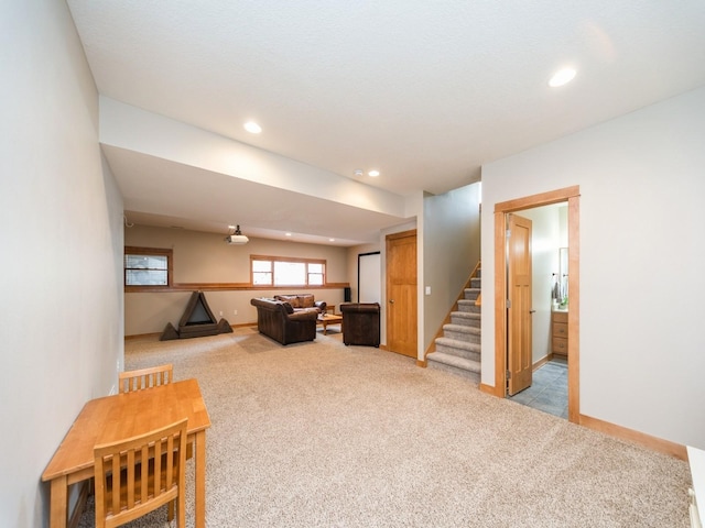 15903 Winston Ave, Urbandale, IA 50323 - living area with light carpet, stairs, recessed lighting, and baseboards