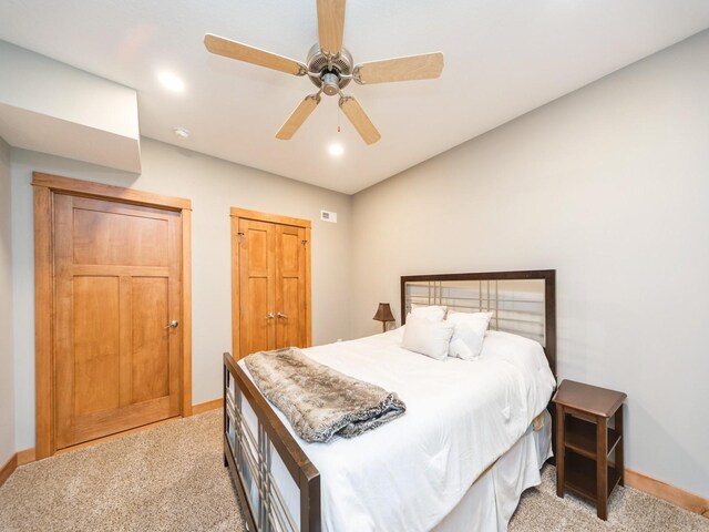 15903 Winston Ave, Urbandale, IA 50323 - bedroom featuring light carpet, baseboards, and a ceiling fan