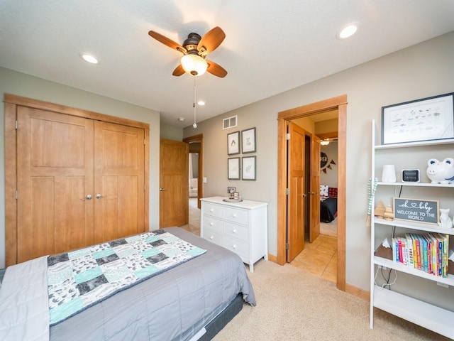 15903 Winston Ave, Urbandale, IA 50323 - bedroom with light colored carpet, recessed lighting, ceiling fan, a closet, and baseboards